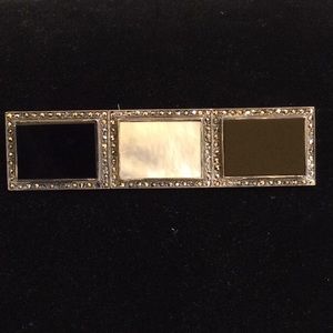 Onyx and mother of pearl brooch